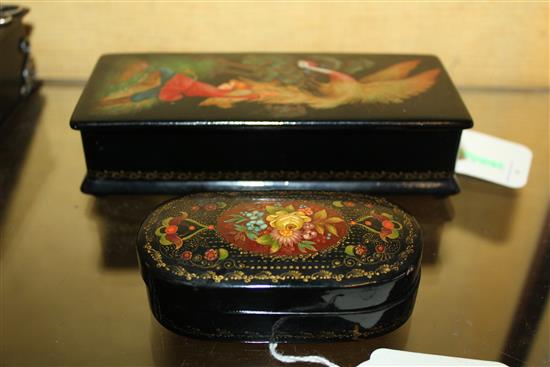 Two Russian lacquered boxes, one decorated a scene from The Firebird, the other with flowers